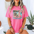 Funny Summer Shirt Raccoon Pool Float Design Vacation Humor Tee Pink Flamingo Float Graphic Sunglasses Wearing Animal Cocktail Drink Detail Perfect Beach Vacation Outfit Pool Party Attire Casual Summer Wear Comfortable Oversized Fit Humor