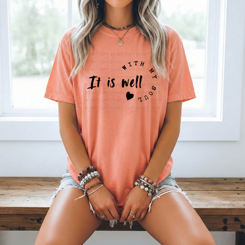 It Is Well With My Soul Shirt Christian Faith Tee Women Inspirational Hymn Lyric Clothing Religious Quote Apparel Casual Worship Wear Church Outfit Coral Peachy Tone Circular Text Design Heart Accent Script Font Gift Christian Women Baptism